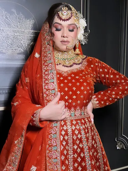 A side profile of the bride, showcasing her elegant hairstyle and makeup.