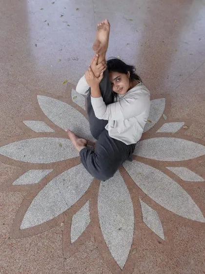 This is me, sitting in the middle of a lotus design, reflecting on my own growth. I'm not here to fit into an Instagram mold. I'm here to share what I've learned the hard way, so your path can be a little clearer.
