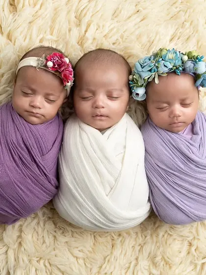 Capturing one newborn is special, but three is a blessing. This photo of triplets, each swaddled comfortably, shows my experience in safely handling and posing multiples for a beautiful, coordinated portrait.