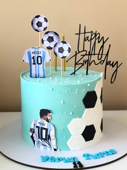 A stylish Lionel Messi-themed cake, celebrating the Argentinian football star.