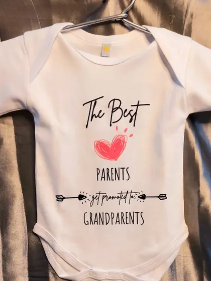 "The Best Parents Get Promoted to Grandparents." This custom baby romper is such a heartwarming way to announce a new arrival to the family.