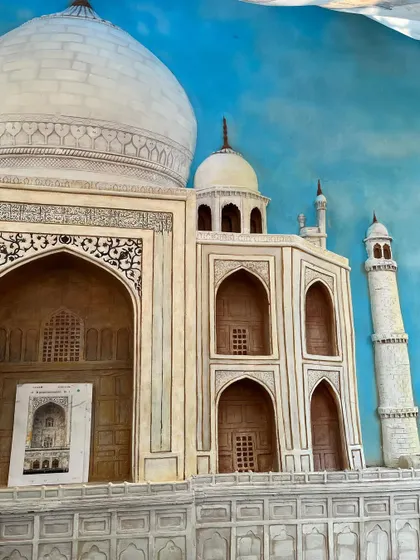 Another view of the Taj Mahal mural, showing a reference photo used to ensure the accuracy of the iconic architecture.