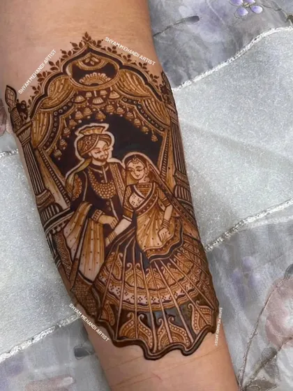 A close-up of a romantic couple portrait, framed beautifully within an ornate arch on the forearm.