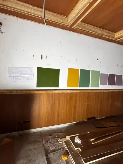More behind-the-scenes madness. This shows the color sampling process for the artwork backdrops in the bar cabinet, ensuring every element was perfectly coordinated before final installation.