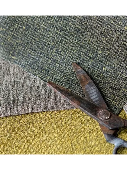 Linen wallpapers bring a soft, tactile warmth to any room. This close-up shows the beautiful, natural weave of the fabric, a perfect choice for creating a cozy and inviting atmosphere.