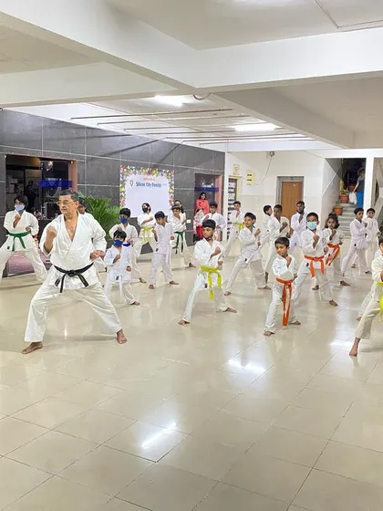 A Sensei leads the class in Kihon practice at the Silicon City dojo, demonstrating the correct form and ensuring every student develops a strong technical base.