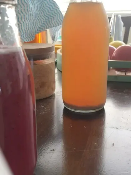 Bottles of homemade juice and kombucha, representing the "from-scratch" mentality that can sometimes lead to orthorexic tendencies if not balanced.