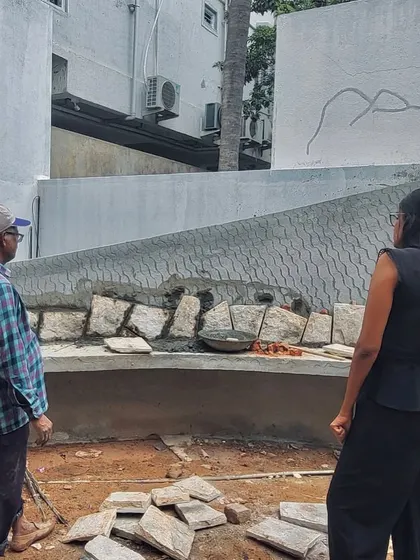 Our co-founder Gayathri Shetty on-site in Koramangala, overseeing the placement of natural stone. Her hands-on involvement ensures that every detail aligns with the design intent.