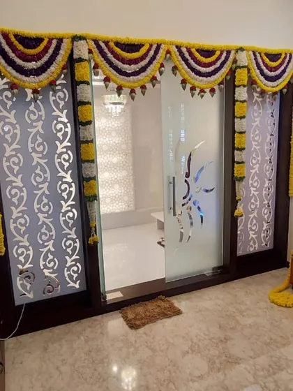 A duplicate of image 48, showing the simple and traditional marigold door decoration.