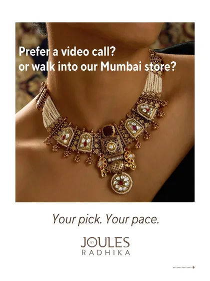 An ornate, architectural bridal necklace, used to highlight the choice between a virtual call or an in-store appointment.