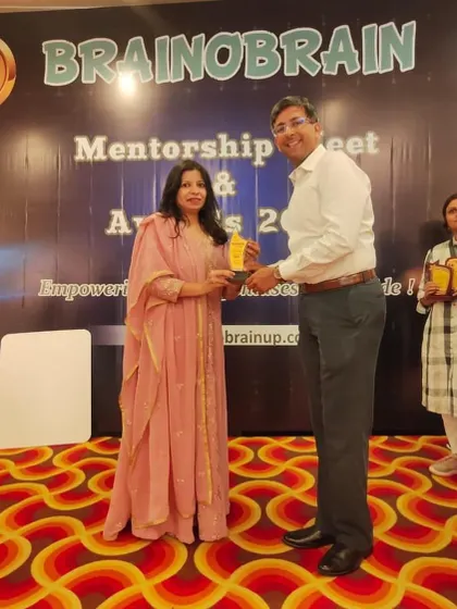 A proud moment receiving an award at the Mentorship Meet and Awards Ceremony. I am grateful for the recognition of our hard work and sincere involvement with the children.