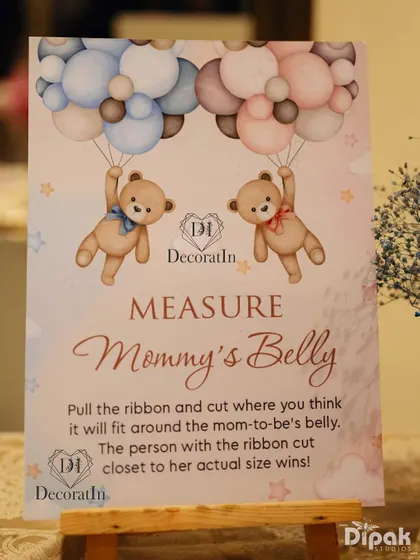 A close-up of the "Measure Mommy's Belly" sign.