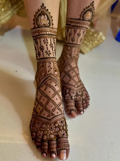 An angled shot of the bridal feet mehendi, showing the design's flow.
