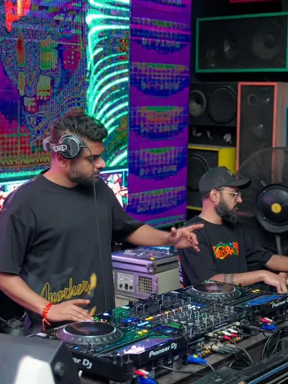 Working the decks alongside another DJ, with Bollywood visuals on the big screen. Collaborative sets bring a unique dynamic to the night.
