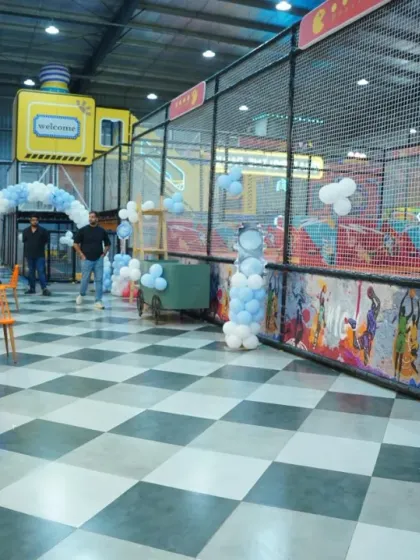 A racing-themed party setup with tire and helmet balloon sculptures, showing our attention to creative detail.