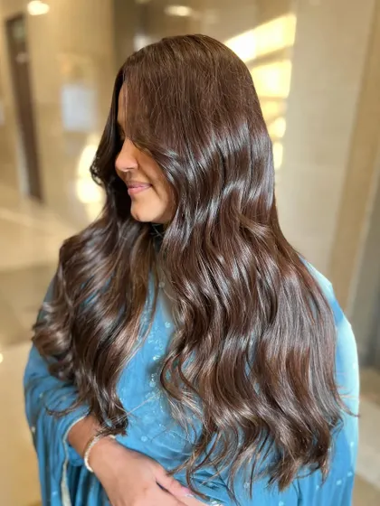 A beautiful side profile of the Gold Browns look. The color is rich and warm, perfect for a bride or anyone wanting a glamorous transformation.