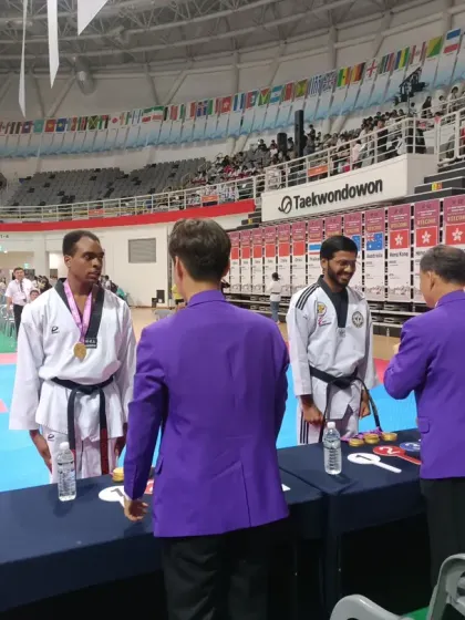 Receiving a medal at the World Taekwondo Culture Expo.