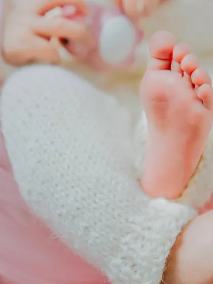 A close-up of tiny newborn feet. These are the details that change so quickly, and the ones you'll love looking back on.