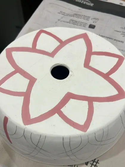 The first layer of color is applied to the lampshade design. This step starts to bring the pattern to life.