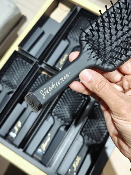 A glimpse from a live personalization event for GHD hairbrushes at Aveda Salon. Each brush was customized with a name in elegant gold script, like this one for 'Stephanie'.