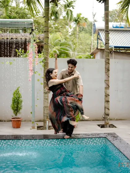 A playful moment by the pool. I encourage couples to have fun and be themselves, which often leads to the most joyful and spontaneous shots like this one.