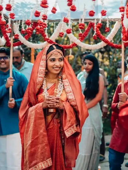 The bride's happy entrance, a classic shot capturing the joy and excitement of the wedding day.