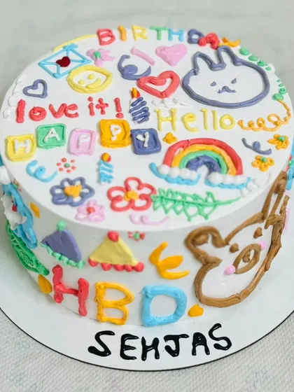 A vibrant and playful doodle-style cake, full of fun characters and colors.