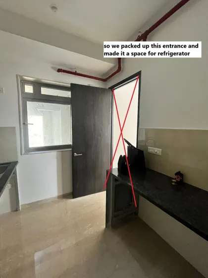 Sometimes, the best layout isn't the one the builder gives you. Here, we decided to pack up an unnecessary kitchen entrance to create a dedicated, clutter-free space for the refrigerator.