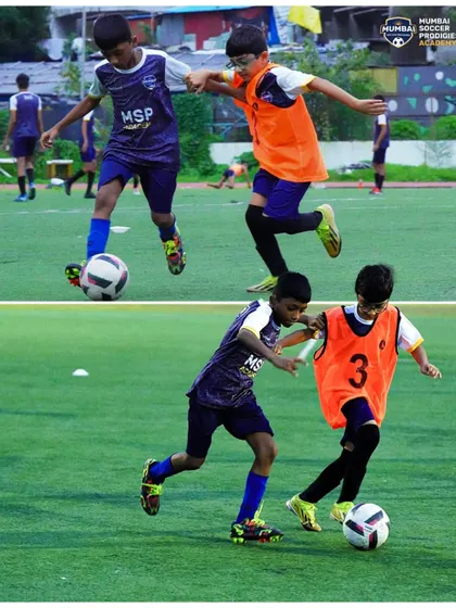 Young players battle for possession, learning the importance of strength and determination.