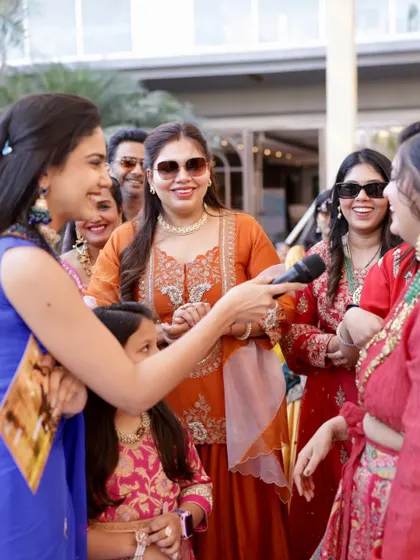 Engaging with the ladies of the family during a daytime function. It's all about those fun-filled conversations and shared laughter.