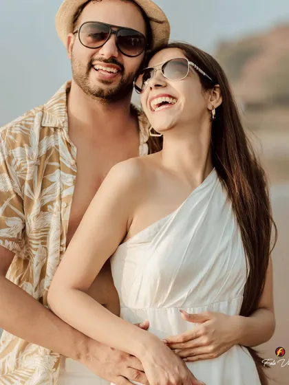 A candid, sun kissed portrait from a beach pre wedding shoot. We use natural light to create warm and romantic images that feel effortless.