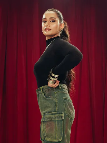 An edgier look for the Freakins campaign, featuring a high ponytail with long, flowing waves and a defined smokey eye. This style is perfect for a confident and modern brand identity.