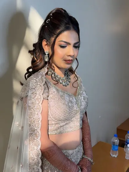 The sunlight catching her skin, highlighting the beautiful, radiant finish of her sangeet makeup.