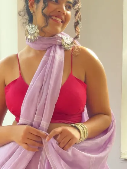 A close-up on the details. The silver jhumkas and the delicate fabric of the lilac saree are the stars here. I believe in investing in quality pieces, both in clothing and jewelry, that you can wear for years to come.