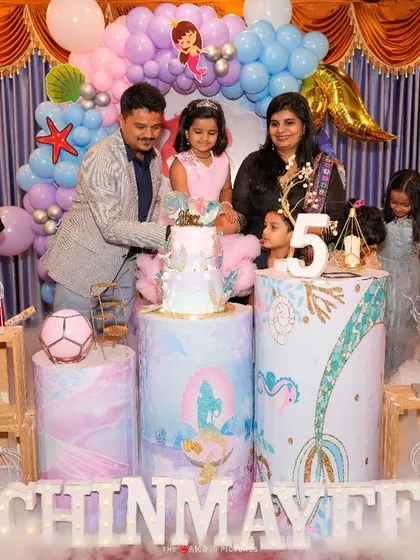 A happy family moment during the cake cutting ceremony, with a Mickey Mouse mascot joining in the fun. We love helping create these joyful memories.