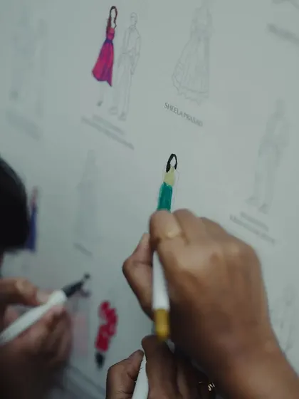 An interactive and personal touch. Guests had fun finding their illustrated selves on this custom guest board and coloring in their outfits, creating a collaborative and colorful memento of the day.