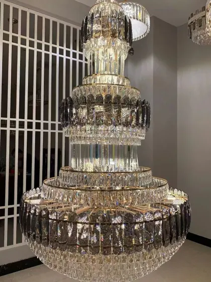 For spaces that demand pure opulence, I offer grand crystal chandeliers like this multi-tiered masterpiece. This is a modern take on the classic jhumar, designed to create a breathtaking cascade of light in a double-height foyer or a luxurious ballroom.