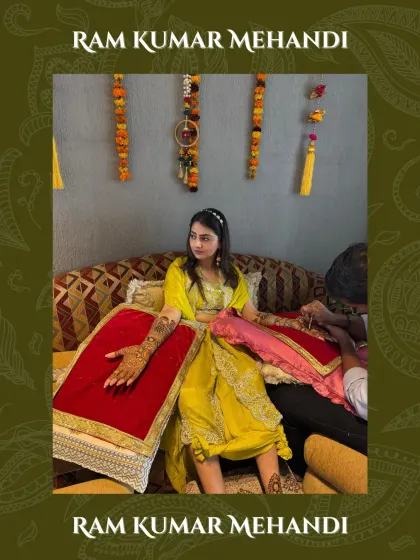 A beautiful shot of a bride during her mehndi ceremony, with my team ensuring her design is perfect from every angle.