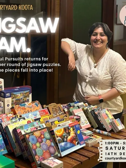 Asma from Playful Pursuits, the puzzle queen who curates our Jigsaw Jam events, stands proudly with her collection of puzzles. Her passion brings joy to our community of puzzlers.