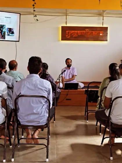 I am conducting a session for the team at Health Heal in my studio. I explain how yogic principles can be integrated into a busy professional life for better balance.