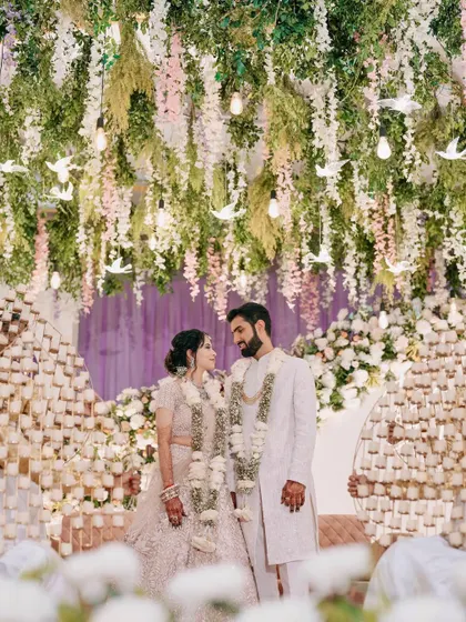 A fairytale engagement setting. The couple looks regal, and the bride's makeup is soft and luminous to match the dreamy decor.