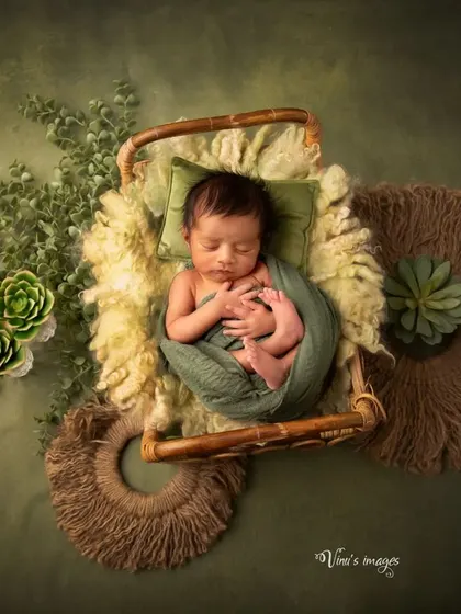 This image showcases the beautiful symmetry and balance in a themed newborn setup. Every prop is placed with intention to create a harmonious and pleasing final portrait.