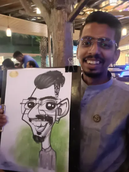 This gentleman's glasses and smile were fun features to exaggerate in his portrait.