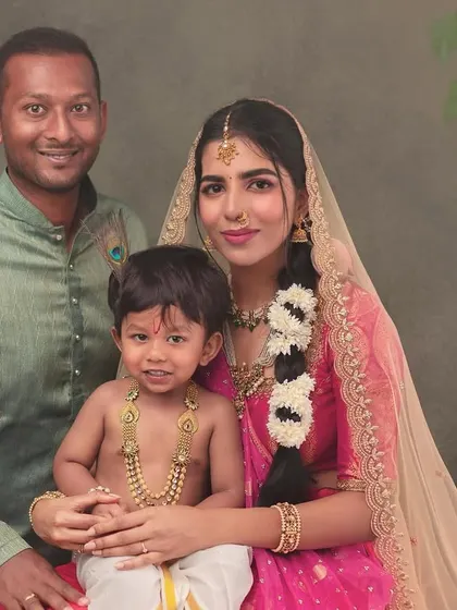 A classic family portrait from our Krishna-themed series. The family looks directly at the camera, creating a powerful and timeless image that will be treasured for generations.