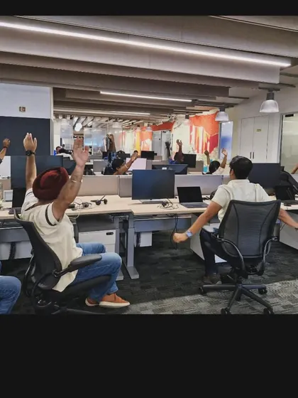 A desk yoga session in progress at Delta Air Lines, with employees enjoying a rejuvenating stretch.