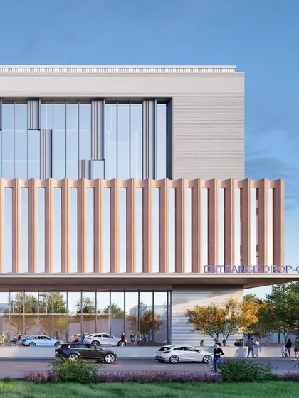 This close-up rendering of the Goenka Super Speciality Hospital entrance shows the covered drop-off area. The design combines functionality with a contemporary aesthetic, creating a welcoming and efficient point of arrival.