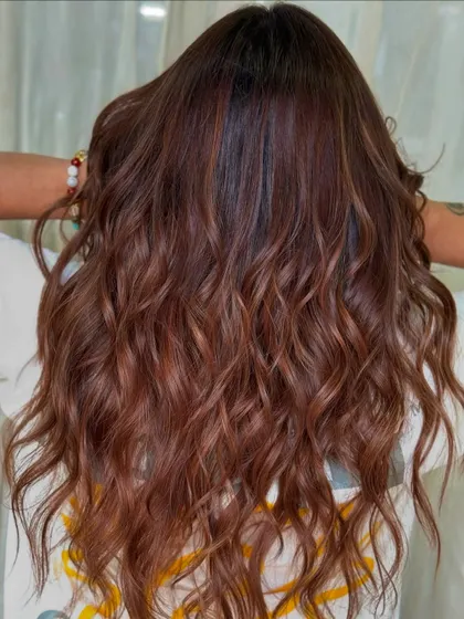 The full view of this stunning, natural-looking hair color. It's the perfect example of a subtle balayage that enhances the client's natural hair.