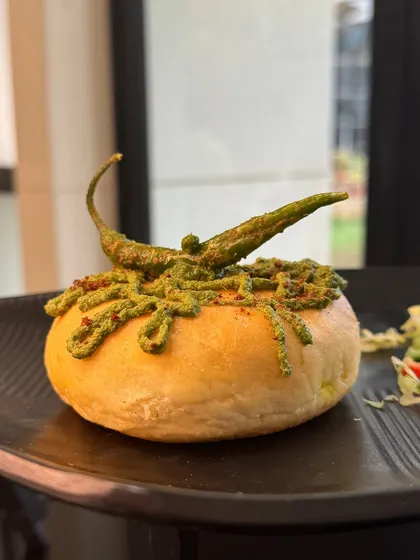 Our Danish Vada Pav is a modern interpretation of a beloved classic. The soft, round bun is generously topped with green chutney and dry garlic powder for an authentic yet refined taste.