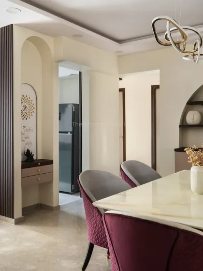 This view shows how the mandir's design harmonizes seamlessly with the dining area, blending traditional spirituality with contemporary elegance to create a peaceful and integrated sacred space.