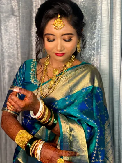 A candid shot capturing the details of her makeup and jewellery.